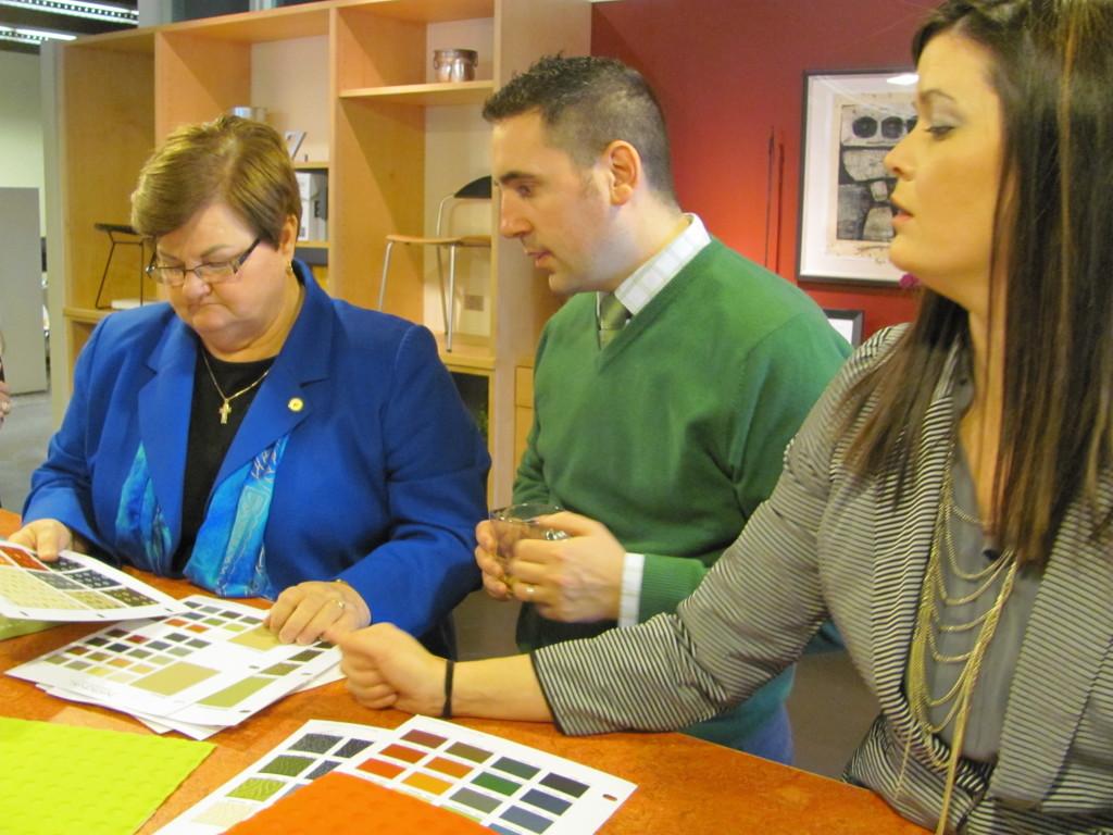 SHU President Peg Albert and Dean of Students Michael Orlando pick out fabric for the ottomans. (Photo by Amy Garno) 