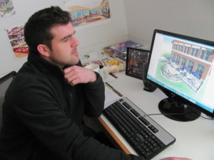 Josh Garno, computer rendering specialist at The Collaborative Inc., develops the artist renderings for SHU's latest building projects (Photo Amy Garno)