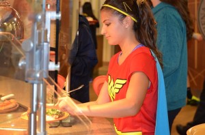 Lucia Alfaro picks her food out from one of many stations in the McLaughlin Dining Center (Photo by Ryan Dukes)