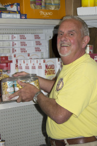 Ken Freshcorn stocks the pantry at the Daily Bread in Adrian, Mich. (Photo by Amy Garno)