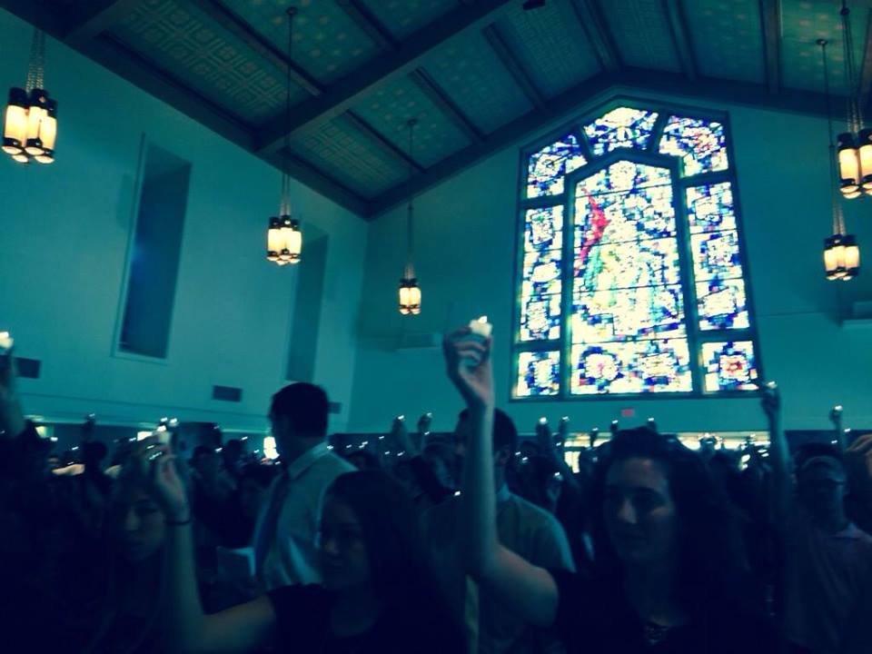 SHU students participate in lighting candles symbolizing academic unity and tradition. (Photo Haley Parker)